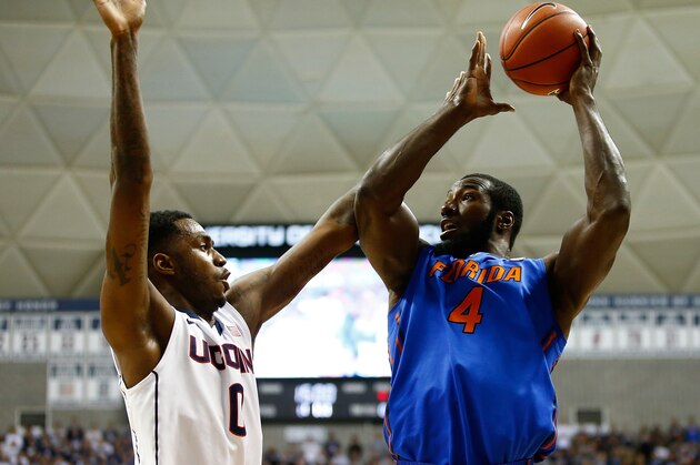 STORRS, CT - DECEMBER 02: Patric Young #4 of the Florida Gators takes a shot in front of Phillip Nolan #0 of the Connecticut Huskies in the first half during the game at Harry A. Gampel Pavilion on December 2, 2013 in Storrs, Connecticut.  (Photo by Jared Wickerham/Getty Images)