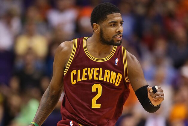 PHOENIX, AZ - MARCH 12:  Kyrie Irving #2 of the Cleveland Cavaliers celebrates after scoring against the Phoenix Suns during the second half of the NBA game at US Airways Center on March 12, 2014 in Phoenix, Arizona.  NOTE TO USER: User expressly acknowledges and agrees that, by downloading and or using this photograph, User is consenting to the terms and conditions of the Getty Images License Agreement.  (Photo by Christian Petersen/Getty Images)