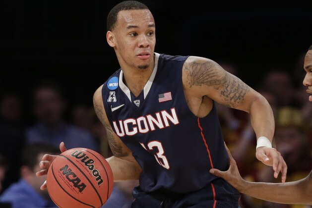 Connecticut's Shabazz Napier (13) is defended by Iowa State's Monte Morris (11) during the first half in a regional semifinal at the NCAA college basketball tournament Friday, March 28, 2014 in New York. (AP Photo/Frank Franklin II)