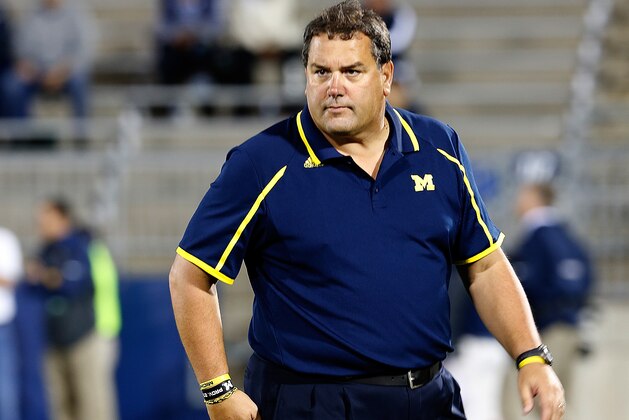 EAST HARTFORD, CT - SEPTEMBER 21:  Brady Hoke, coach of the Michigan Wolverines watches the pre-game action before a game with the Connecticut Huskies at Rentschler Field on September 21, 2013 in East Hartford, Connecticut.   (Photo by Jim Rogash/Getty Images)