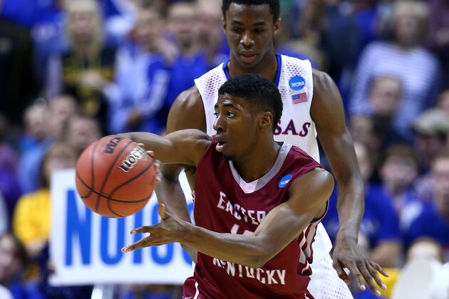 ST LOUIS, MO - MARCH 21:  Andrew Wiggins #22 of the Kansas Jayhawks defends Marcus Lewis #12 of the Eastern Kentucky Colonels during the second round of the 2014 NCAA Men's Basketball Tournament at Scottrade Center on March 21, 2014 in St Louis, Missouri.  (Photo by Andy Lyons/Getty Images)