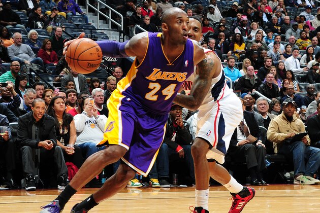 ATLANTA, GA - DECEMBER 16: Kobe Bryant #24 of the Los Angeles Lakers drives to the basket against the Atlanta Hawks on December 16, 2013 at Philips Arena in Atlanta, Georgia.  NOTE TO USER: User expressly acknowledges and agrees that, by downloading and/or using this Photograph, user is consenting to the terms and conditions of the Getty Images License Agreement. Mandatory Copyright Notice: Copyright 2013 NBAE (Photo by Scott Cunningham/NBAE via Getty Images)