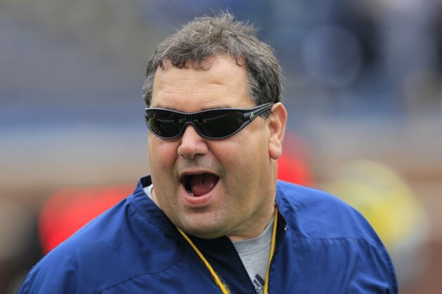 Michigan head football coach Brady Hoke watches practice before a spring football scrimmage at Michigan Stadium in Ann Arbor, Mich., Saturday, April 14, 2012. (AP Photo/Carlos Osorio)