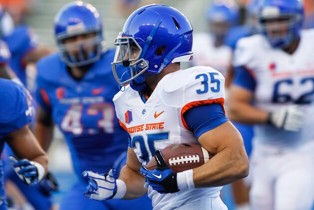 In this Aug. 18, 2013 photo, Boise State running back Charles Bertoli (35) runs the ball during an NCAA college football practice in Boise, Idaho. (AP Photo/Otto Kitsinger)