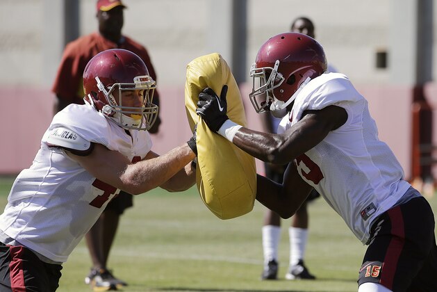 Southern California wide receiver Robby Kolanz, left, pushes wide receiver Nelson Agholor during NCAA college football practice on Tuesday, Aug. 6, 2013, in Los Angeles. (AP Photo/Jae C. Hong)