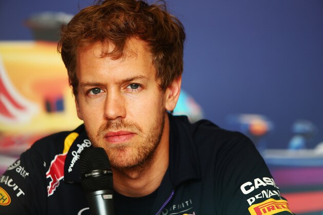 SAKHIR, BAHRAIN - APRIL 03: Sebastian Vettel of Germany and Infiniti Red Bull Racing is interviewed by the media during previews for the Bahrain Formula One Grand Prix at the Bahrain International Circuit on April 3, 2014 in Sakhir, Bahrain. (Photo by Clive Mason/Getty Images) SAKHIR, BAHRAIN - APRIL 03: Sebastian Vettel of Germany and Infiniti Red Bull Racing is interviewed by the media during previews for the Bahrain Formula One Grand Prix at the Bahrain International Circuit on April 3, 2014 in Sakhir, Bahrain. (Photo by Clive Mason/Getty Images)