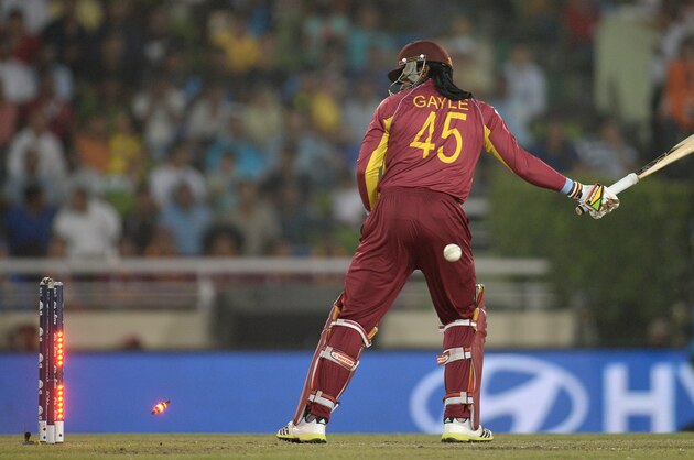DHAKA, BANGLADESH - APRIL 03:  Chris Gayle of the West Indies is bowled by Lasith Malinga of Sri Lanka  during the ICC World Twenty20 Bangladesh 2014 semi final between Sri Lanka and the West Indies at Sher-e-Bangla Mirpur Stadium on April 3, 2014 in Dhaka, Bangladesh.  (Photo by Gareth Copley/Getty Images)