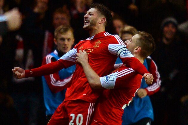 SOUTHAMPTON, ENGLAND - JANUARY 28:  Adam Lallana of Southampton celebrates scoring their second goal with Luke Shaw of Southampton during the Barclays Premier League match between Southampton and Arsenal at St Mary's Stadium on January 28, 2014 in Southampton, England.  (Photo by Mike Hewitt/Getty Images)