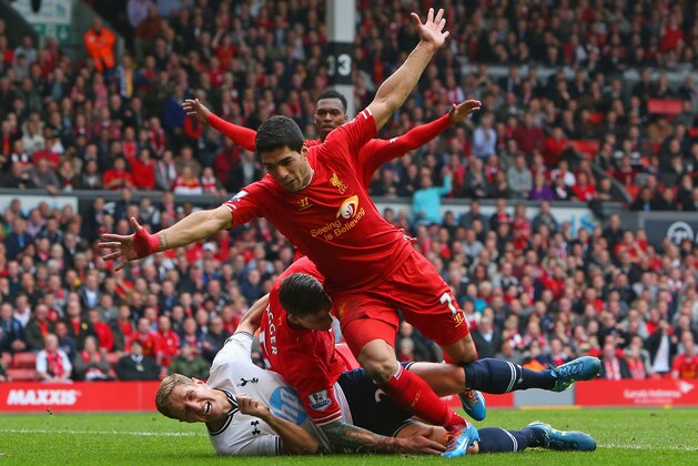 LIVERPOOL, ENGLAND - MARCH 30:  Luis Suarez celebrates after Jordan Henderson of Liverpool scored the fourth goal during the Barclays Premier League match between Liverpool and Tottenham Hotspur at Anfield on March 30, 2014 in Liverpool, England.  (Photo by Alex Livesey/Getty Images)