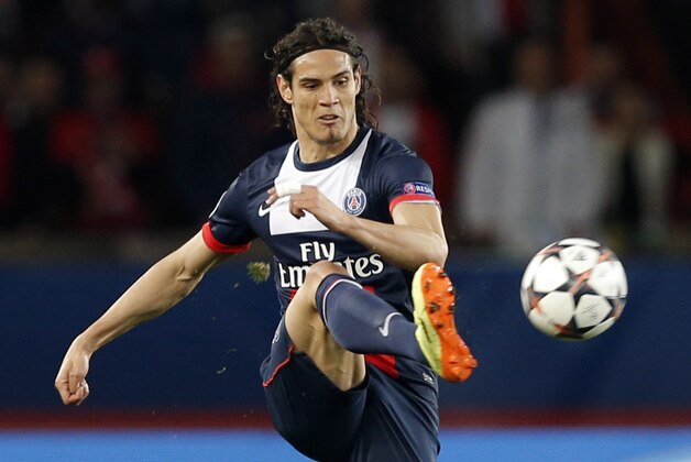 PSG's Edinson Cavani kicks during the Champions League quarterfinal first leg soccer match between PSG and Chelsea, at the Parc des Princes stadium, in Paris, Wednesday, April 2, 2014. (AP Photo/Christophe Ena)
