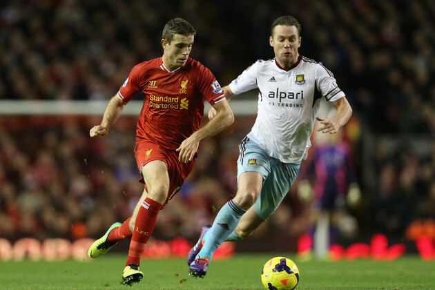 LIVERPOOL, ENGLAND - DECEMBER 07:  Kevin Nolan of West Ham United competes with Jordan Henderson of Liverpool during the Barclays Premier League match between Liverpool and West Ham United at Anfield on December 7, 2013 in Liverpool, England.  (Photo by Clive Brunskill/Getty Images)