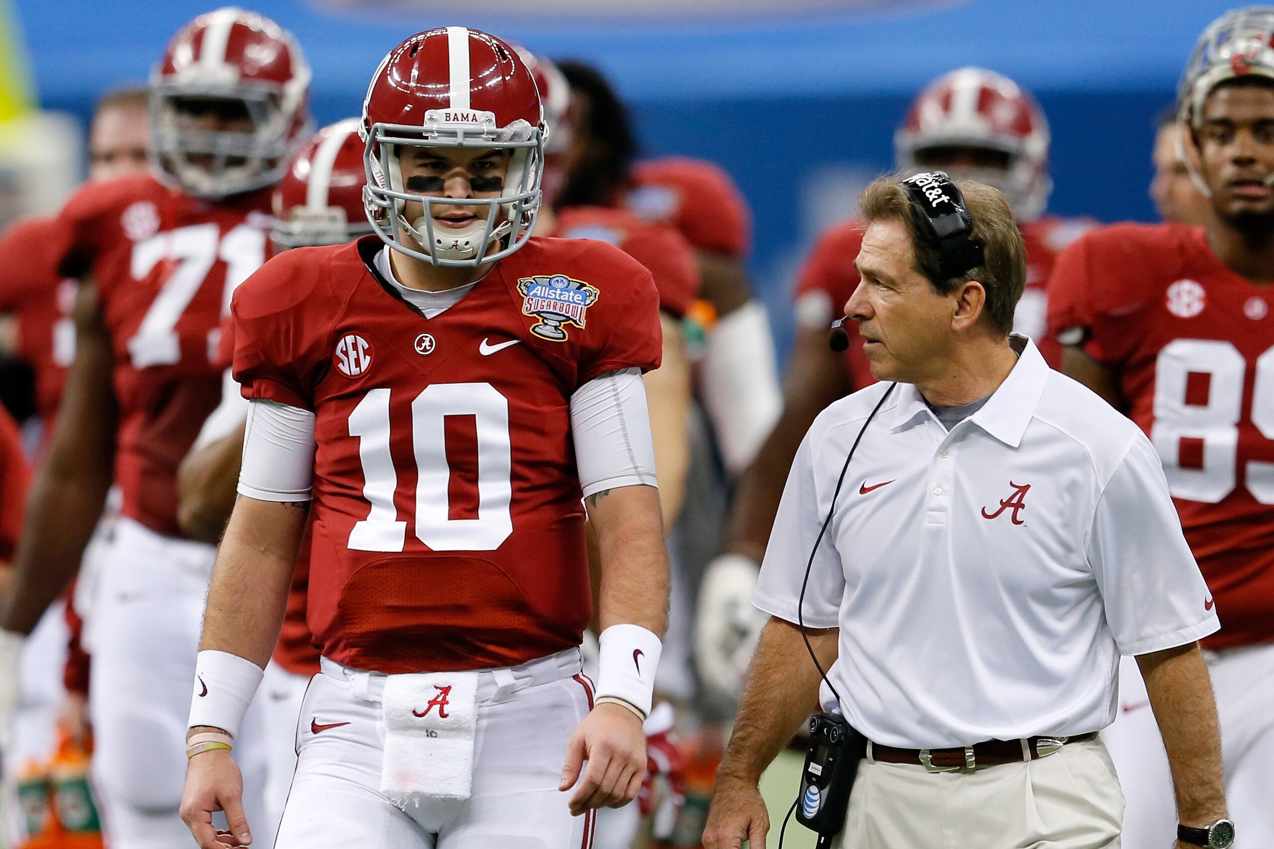 NEW ORLEANS, LA - JANUARY 02:  AJ McCarron #10 of the Alabama Crimson Tide talks with head coach Nick Saban during a time out against the Oklahoma Sooners during the Allstate Sugar Bowl at the Mercedes-Benz Superdome on January 2, 2014 in New Orleans, Louisiana.  (Photo by Kevin C. Cox/Getty Images)