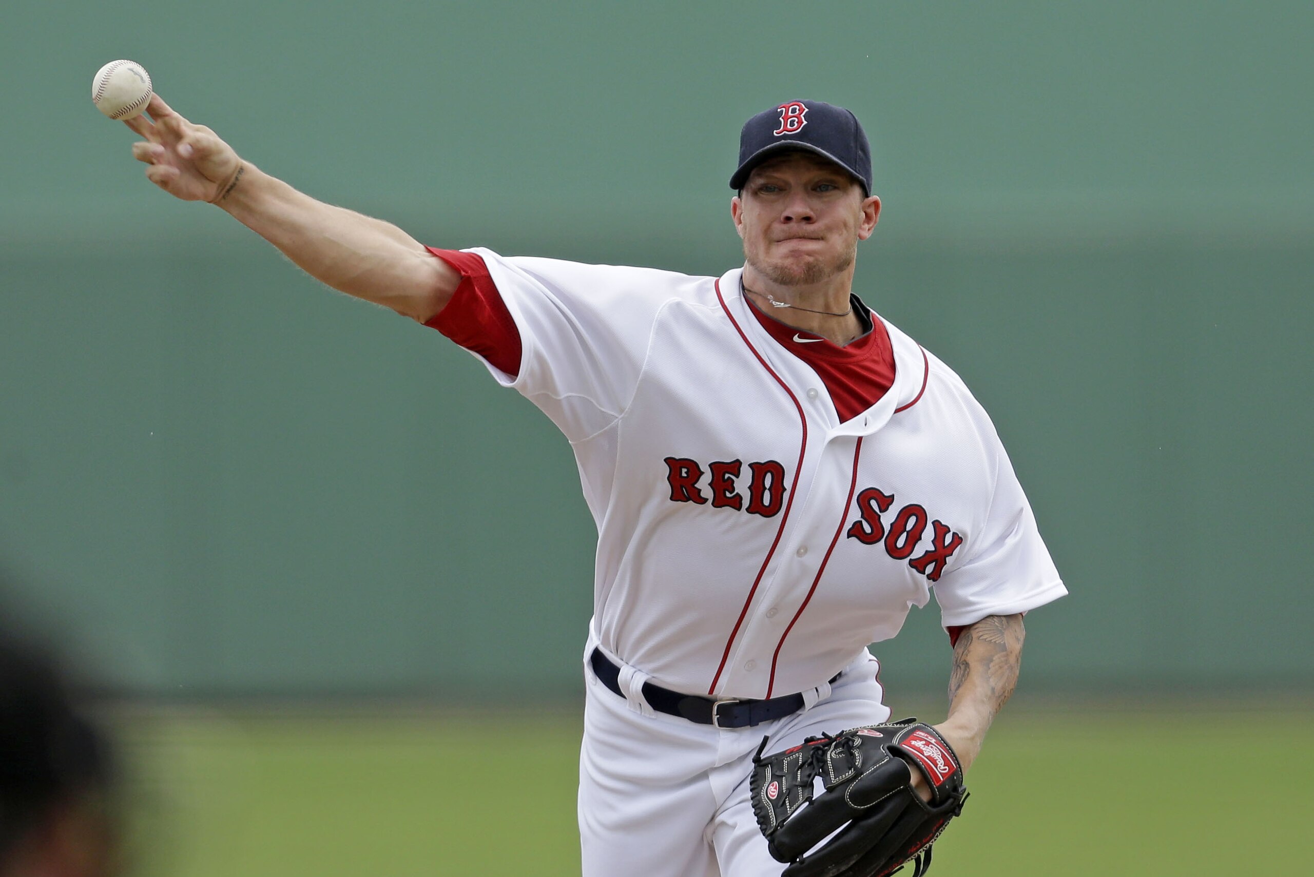 Boston Red Sox starting pitcher Jake Peavy (44) pitches during the first inning of an exhibition baseball game against the Minnesota Twins in Fort Myers, Fla., Saturday, March 29, 2014. (AP Photo/Gerald Herbert)