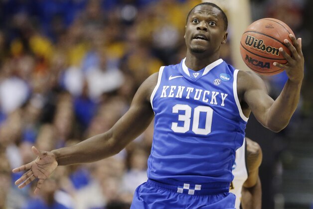 Kentucky forward Julius Randle (30) grabs the ball against Wichita State during the first half of a third-round game of the NCAA college basketball tournament Sunday, March 23, 2014, in St. Louis. (AP Photo/Charlie Riedel)