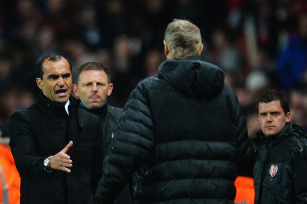 LONDON, ENGLAND - MAY 14:  (L-R) Roberto Martinez the Wigan Athletic manager shakes hands with Arsene Wenger the Arsenal manager at the end of the Barclays Premier League match between Arsenal and Wigan Athletic at Emirates Stadium on May 14, 2013 in London, England.  (Photo by Shaun Botterill/Getty Images)