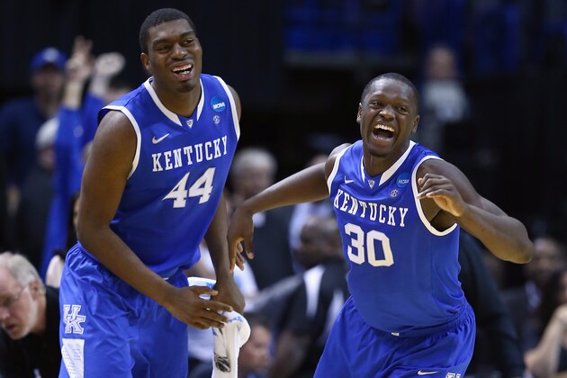 ST LOUIS, MO - MARCH 23:  Julius Randle #30 of the Kentucky Wildcats celebrates with teammate Dakari Johnson #44 after defeating the Wichita State Shockers 78 to 76 during the third round of the 2014 NCAA Men's Basketball Tournament at Scottrade Center on March 23, 2014 in St Louis, Missouri.  (Photo by Andy Lyons/Getty Images)