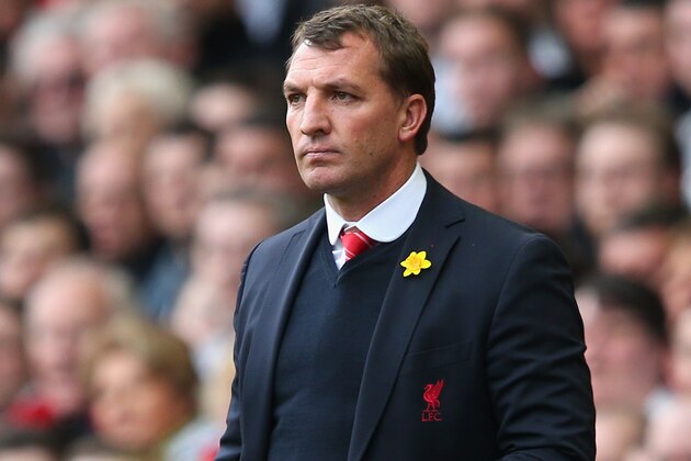 LIVERPOOL, ENGLAND - MARCH 30:  Liverpool Manager Brendan Rodgers takes notes during the Barclays Premier League match between Liverpool and Tottenham Hotspur at Anfield on March 30, 2014 in Liverpool, England.  (Photo by Alex Livesey/Getty Images)
