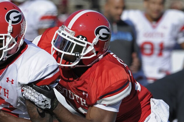 Senior Bowl South Squad wide receiver Tavarres King of Georgia (12) catches a pass during Senior Bowl football practice as defensive back Sanders Commings of Georgia (29) defends at Ladd-Peebles Stadium in Mobile, Ala., Tuesday, Jan. 22, 2013.(AP Photo/GM Andrews)