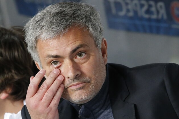 Chelsea's manager Jose Mourinho sits in the technical area prior to the start of the Champions League quarterfinal first leg soccer match between Paris Saint-Germain and Chelsea at Parc des Princes stadium in Paris, Wednesday, April 2, 2014. (AP Photo/Michel Euler)