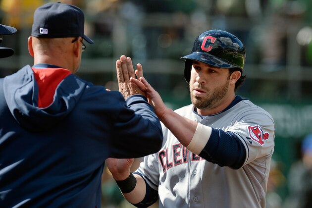 OAKLAND, CA - APRIL 02:  Jason Kipnis #22 of the Cleveland Indians is congratulated by manager Terry Francona (L) after Kipnis scored against the Oakland Athletics during the top of the ninth inning at O.co Coliseum on April 2, 2014 in Oakland, California. Kipnis scored on an RBI single from Carlos Santana. (Photo by Thearon W. Henderson/Getty Images)