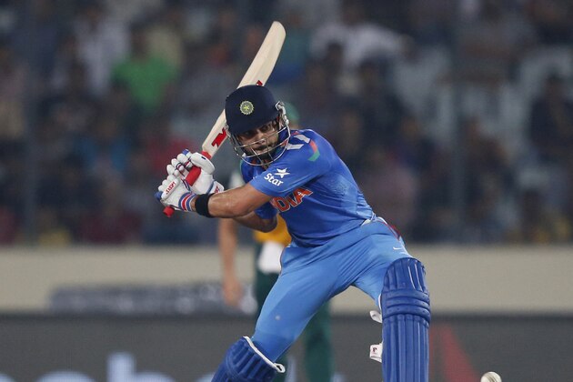 India's batsman Virat Kohli plays a shot during their ICC Twenty20 Cricket World Cup semi-final match against South Africa in Dhaka, Bangladesh, Friday, April 4, 2014. (AP Photo/Aijaz Rahi)