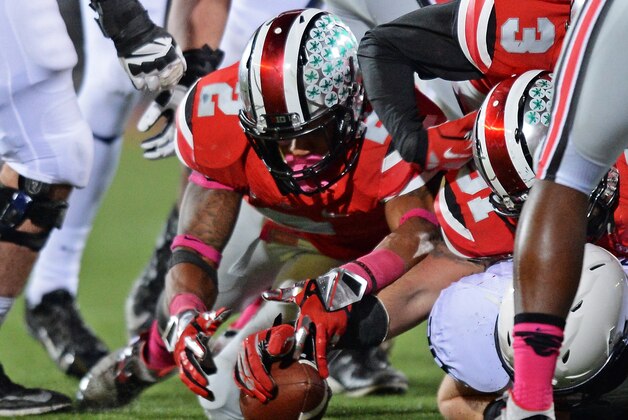 COLUMBUS, OH - OCTOBER 26:  Ryan Shazier #2 of the Ohio State Buckeyes and Joel Hale #51 of the Ohio State Buckeyes dive on a loose ball to make a fumble recovery in the third quarter against the Penn State Nittany Lions at Ohio Stadium on October 26, 2013 in Columbus, Ohio. Ohio State defeated Penn State 63-14.  (Photo by Jamie Sabau/Getty Images)