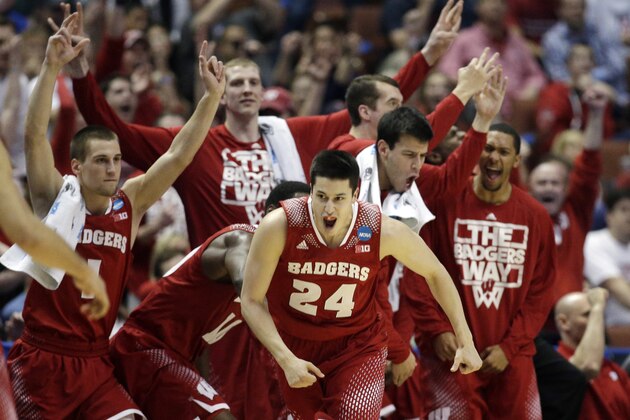 Wisconsin 's Bronson Koenig (24) reacts after making a three-point basket during the second half in a regional final NCAA college basketball tournament game against Arizona, Saturday, March 29, 2014, in Anaheim, Calif. (AP Photo/Jae C. Hong)
