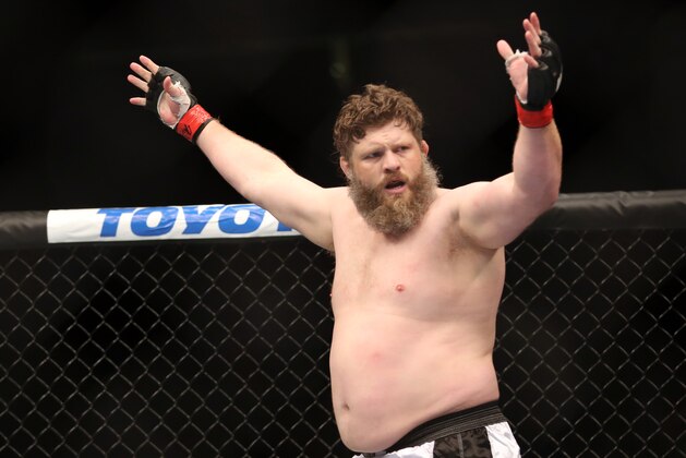 Roy Nelson celebrates his win over Cheick Kongo after their UFC 159 Mixed Martial Arts heavyweight bout in Newark, NJ, Saturday, April 27,2013.  Nelson won via first round KO. (AP Photo/Gregory Payan)