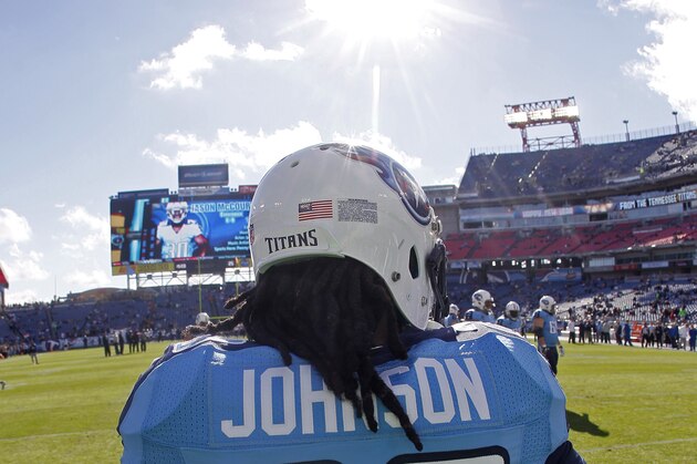 Tennessee Titans running back Chris Johnson (28) his team warm up before an NFL football game against the Houston Texans Sunday, Dec. 29, 2013, in Nashville, Tenn. (AP Photo/Wade Payne)
