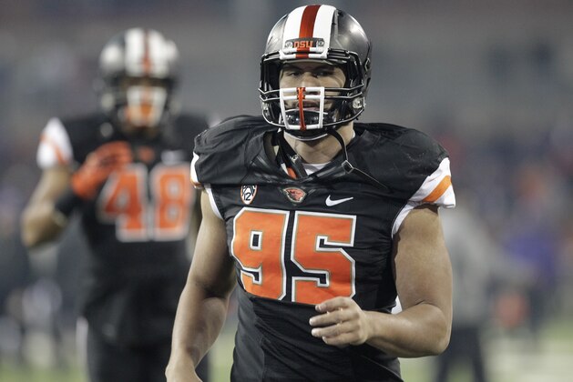 Oregon State defensive end Scott Crichton is shown during an NCAA college football game against Washington in Corvallis, Ore., Saturday, Nov. 23, 2013.  (AP Photo/Don Ryan)