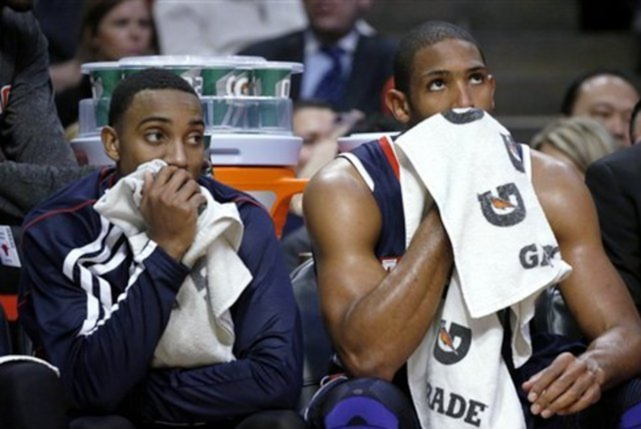 Atlanta Hawks' Jeff Teague, left, and Al Horford sit on the bench during the second half of an NBA basketball game against the Chicago Bulls on Monday, Jan. 14, 2013, in Chicago. The Bulls won 97-58. (AP Photo/Charles Rex Arbogast)