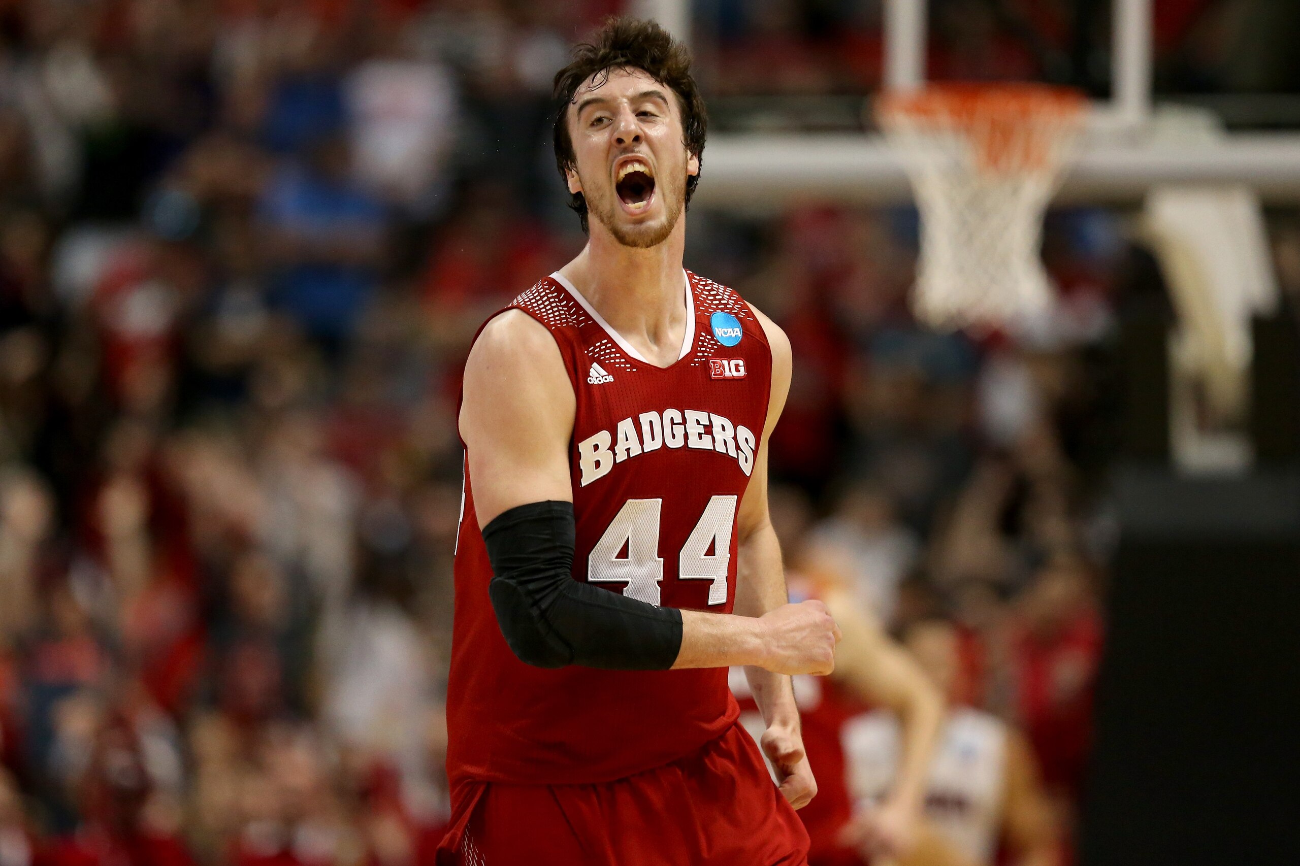 ANAHEIM, CA - MARCH 29:  Frank Kaminsky #44 of the Wisconsin Badgers celebrates after making a three-pointer in the second half while taking on the Arizona Wildcats during the West Regional Final of the 2014 NCAA Men's Basketball Tournament at the Honda Center on March 29, 2014 in Anaheim, California.  (Photo by Jeff Gross/Getty Images)