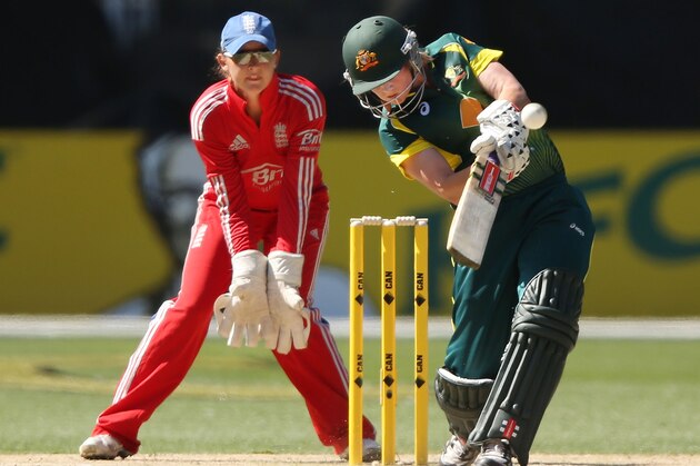 MELBOURNE, AUSTRALIA - JANUARY 31:  Meg Lanning of Australia hits a six off Natalie Sciver of England during game two of the International Twenty20 series between Australia and England at the Melbourne Cricket Ground on January 31, 2014 in Melbourne, Australia.  (Photo by Michael Dodge/Getty Images)
