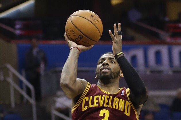 Cleveland Cavaliers' Kyrie Irving (2) takes a shot against the Orlando Magic during the first half of an NBA basketball game in Orlando, Fla., Wednesday, April 2, 2014. (AP Photo/John Raoux)