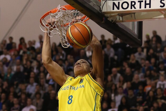 AUCKLAND, NEW ZEALAND - AUGUST 14:  Ben Simmons of Australia slam dunks during the Men's FIBA Oceania Championship match between the New Zealand Tall Blacks and the Australian Boomers at North Shore Events Centre on August 14, 2013 in Auckland, New Zealand.  (Photo by Sandra Mu/Getty Images)