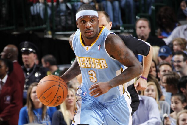 DALLAS, TX - MARCH 21: Ty Lawson #3 of the Denver Nuggets dribbles the ball during the game against the Dallas Mavericks on March 21, 2014 at the American Airlines Center in Dallas, Texas. NOTE TO USER: User expressly acknowledges and agrees that, by downloading and or using this photograph, User is consenting to the terms and conditions of the Getty Images License Agreement. Mandatory Copyright Notice: Copyright 2014 NBAE (Photo by Glenn James/NBAE via Getty Images)