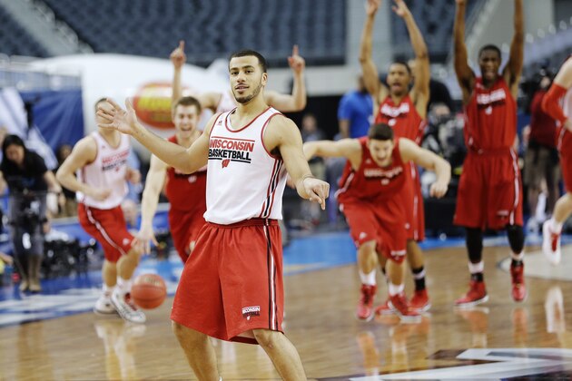 Wisconsin guard Traevon Jackson reacts after making a half-court shot at the end of practice for an NCAA Final Four tournament college basketball semifinal game Friday, April 4, 2014, in Dallas. Wisconsin plays Kentucky on Saturday, April 5, 2014. (AP Photo/Eric Gay)