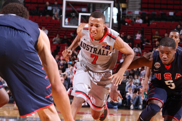 PORTLAND, OR - APRIL 20:  Dante Exum #7 of the World Select Team drives against the USA Junior Select Team during the game on April 20, 2013 at the Rose Garden Arena in Portland, Oregon. NOTE TO USER: User expressly acknowledges and agrees that, by downloading and or using this photograph, User is consenting to the terms and conditions of the License Agreement. Mandatory Copyright Notice: Copyright 2012 (Photo by Sam Forencich)