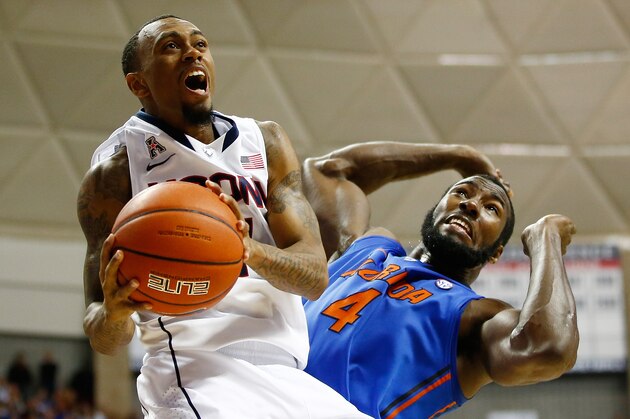 STORRS, CT - DECEMBER 02: Ryan Boatright #11 of the Connecticut Huskies drives to the basket in front of Patric Young #4 of the Florida Gators in the second half during the game at Harry A. Gampel Pavilion on December 2, 2013 in Storrs, Connecticut.  (Photo by Jared Wickerham/Getty Images)