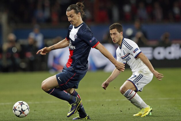PSG's Zlatan Ibrahimovic, left, is challenged by Chelsea's Eden Hazard during the Champions League quarterfinal first leg soccer match between PSG and Chelsea, at the Parc des Princes stadium, in Paris, Wednesday, April 2, 2014. (AP Photo/Christophe Ena)