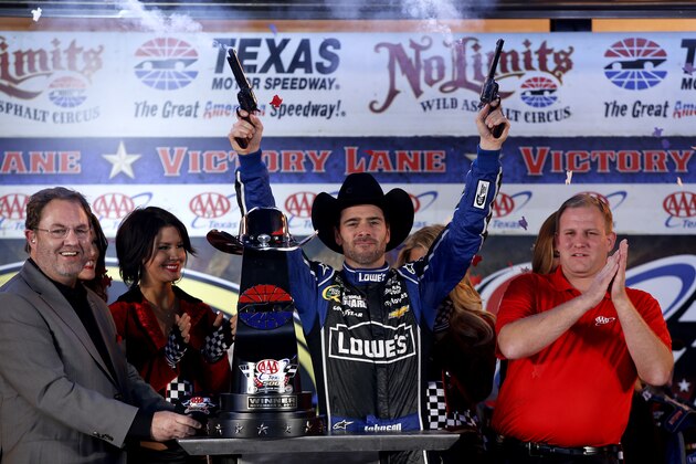 FORT WORTH, TX - NOVEMBER 03:  Jimmie Johnson, driver of the #48 Lowe's Chevrolet, celebrates with Texas Motor Speedway president Eddie Gossage in victory lane after winning the NASCAR Sprint Cup Series AAA Texas 500 at Texas Motor Speedway on November 3, 2013 in Fort Worth, Texas.  (Photo by Chris Graythen/Getty Images for Texas Motor Speedway)