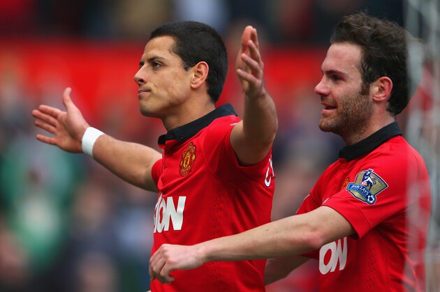 MANCHESTER, ENGLAND - MARCH 29:  Javier Hernandez of Manchester United celebrates scoring his team's fourth goal with Juan Mata (R) during the Barclays Premier League match between Manchester United and Aston Villa at Old Trafford on March 29, 2014 in Manchester, England.  (Photo by Alex Livesey/Getty Images)