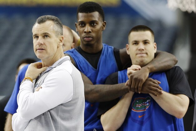 From left, Florida head coach Billy Donovan, forward Chris Walker, and guard Billy Donovan watch a drill during practice for their NCAA Final Four tournament college basketball semifinal game Friday, April 4, 2014, in Dallas. Florida plays Connecticut on Saturday, April 5, 2014. (AP Photo/David J. Phillip)