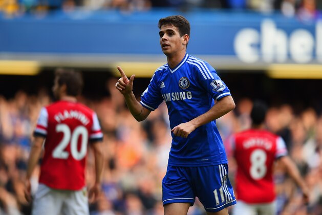 LONDON, ENGLAND - MARCH 22:  Oscar of Chelsea celebrates scoring their fifth goal during the Barclays Premier League match between Chelsea and Arsenal at Stamford Bridge on March 22, 2014 in London, England.  (Photo by Shaun Botterill/Getty Images)