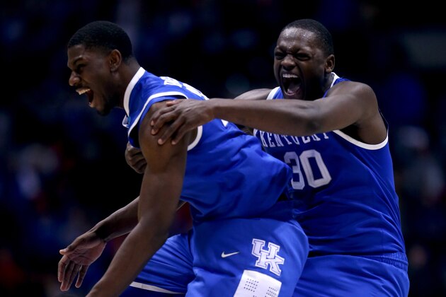 INDIANAPOLIS, IN - MARCH 28: Alex Poythress #22 and Julius Randle #30 of the Kentucky Wildcats celebrate defeating the Louisville Cardinals 74 to 69 during the regional semifinal of the 2014 NCAA Men's Basketball Tournament at Lucas Oil Stadium on March 28, 2014 in Indianapolis, Indiana. (Photo by Jonathan Daniel/Getty Images) INDIANAPOLIS, IN - MARCH 28: Alex Poythress #22 and Julius Randle #30 of the Kentucky Wildcats celebrate defeating the Louisville Cardinals 74 to 69 during the regional semifinal of the 2014 NCAA Men's Basketball Tournament at Lucas Oil Stadium on March 28, 2014 in Indianapolis, Indiana. (Photo by Jonathan Daniel/Getty Images)
