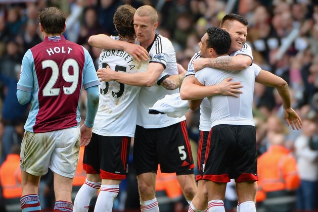BIRMINGHAM, ENGLAND - APRIL 05:  Fernando Amorebieta, Brede Hangeland, John Arne Riise and Kieran Richardson of Fulham celebrate at the end of the match during the Barclays Premier League match between Aston Villa and Fulham at Villa Park on April 5, 2014 in Birmingham, England.  (Photo by Ross Kinnaird/Getty Images)