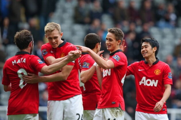 NEWCASTLE UPON TYNE, ENGLAND - APRIL 05: Juan Mata of Manchester United celebrates with team mates during the Barclays Premier League match between Newcastle United and Manchester United  at St James' Park on April 5, 2014 in Newcastle upon Tyne, England.  (Photo by Jan Kruger/Getty Images)