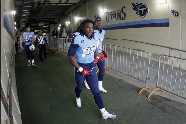 Tennessee Titans running back Chris Johnson (28) walks to the field before an NFL football game between the Titans and the Houston Texans Sunday, Dec. 29, 2013, in Nashville, Tenn. (AP Photo/Wade Payne)