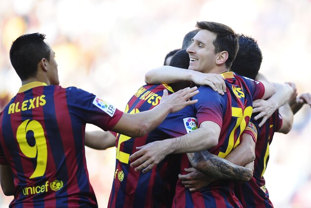 FC Barcelona's Lionel Messi, second right, reacts after scoring during a Spanish La Liga soccer match against Betis at the Camp Nou stadium in Barcelona, Spain, Saturday, April 5, 2014. (AP Photo/Manu Fernandez) FC Barcelona's Lionel Messi, second right, reacts after scoring during a Spanish La Liga soccer match against Betis at the Camp Nou stadium in Barcelona, Spain, Saturday, April 5, 2014. (AP Photo/Manu Fernandez)