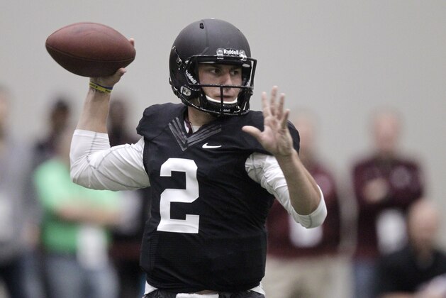 Texas A&M quarterback Johnny Manziel passes the ball during a drill at pro day for NFL football representatives in College Station, Texas, Thursday, March 27, 2014. (AP Photo/Patric Schneider)